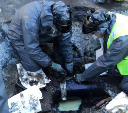 Dielectric fluid leaks can have financial, environmental, and service implications. Here a clamp is being installed to stop an active leak.