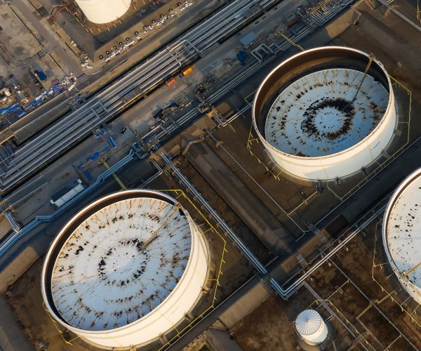 Aerial view or top view oil terminal is industrial facility for storage of oil and petrochemical. oil manufacturing products ready for transport and business transportation.