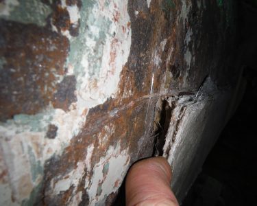 Corrosion Behind Poorly Adhered Fiberglass Coating