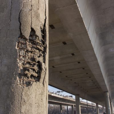Damaged bridge support close - up transportatin concrete
