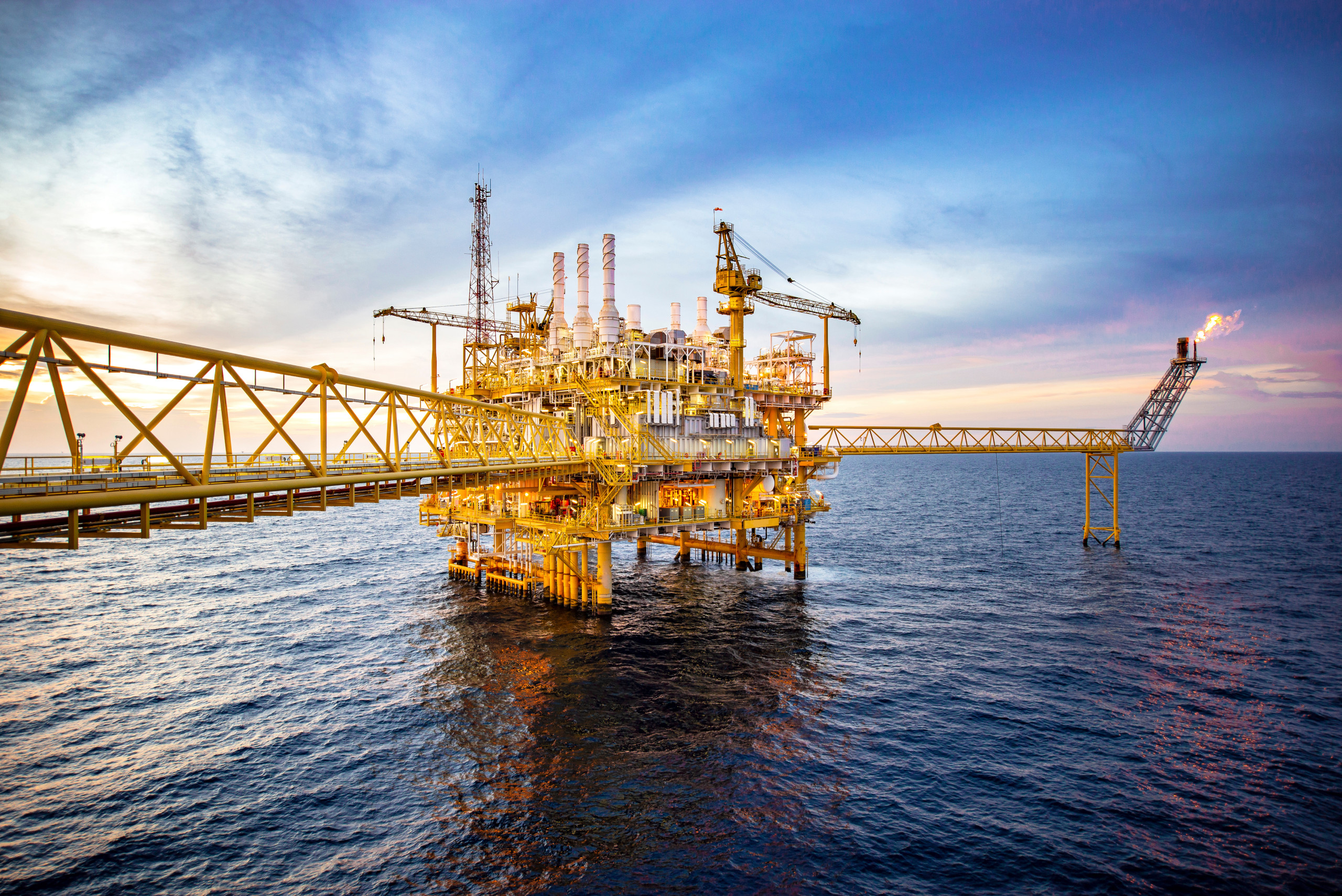 Offshore oil and gas rig platform with beautiful sky.