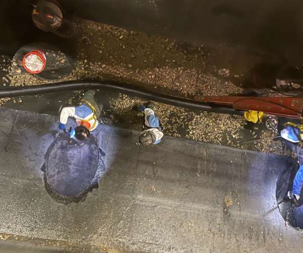 Aerial view of multiple workers repairing concrete.