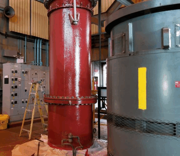 Raw sewage intake pipe painted with red primer.