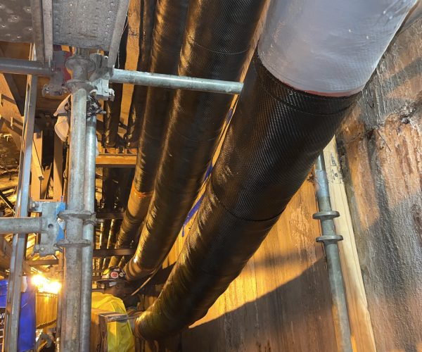 Long view of pipes with composite pipe repair
