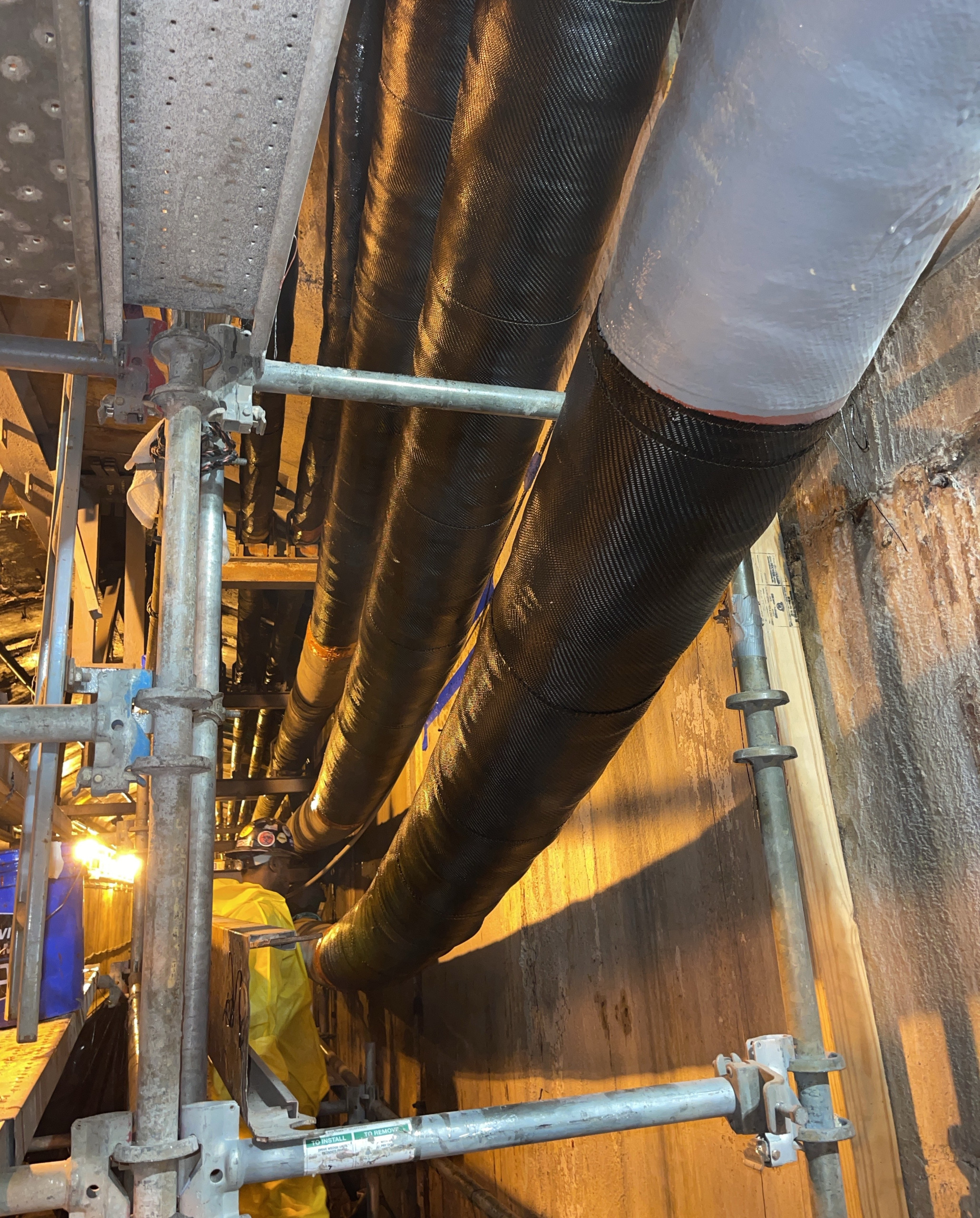 Long view of pipes with composite pipe repair