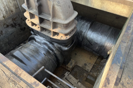 Composite wrap repair on large underground pipeline