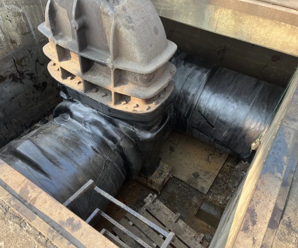 Composite wrap repair on large underground pipeline